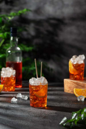 Bar conceprt. Summer Italian cocktail with ice and orange, selective focus imageの写真素材