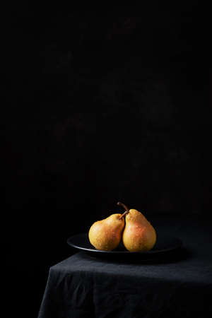 Fresh sweet pears on the dark background, selective focus imageの写真素材