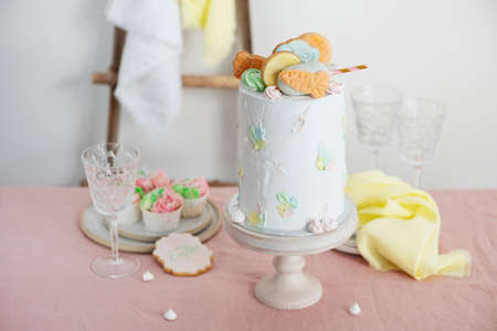 Sweet homemade cake with carrto cookies for Easter fiest, selective focus image