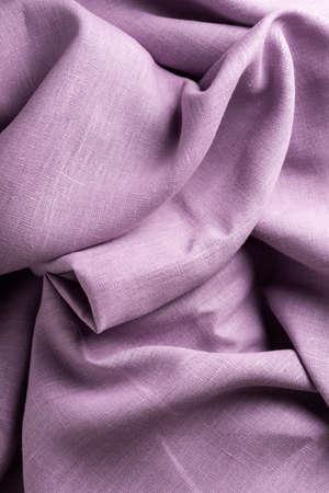 Texture with linen fabric in lavender color, selective focus image