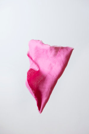 Intensive pink linen napkin, selective focus image