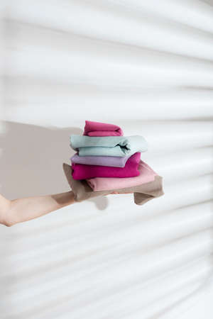 Fashion and sewing concept, colored linen fabric with hard sun lights, selective focus image