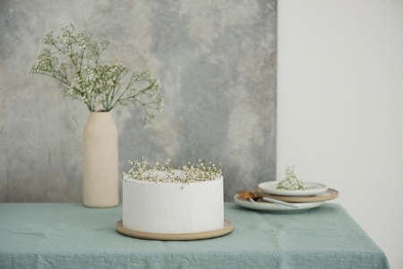 White wedding cake with flowers, selective focus image