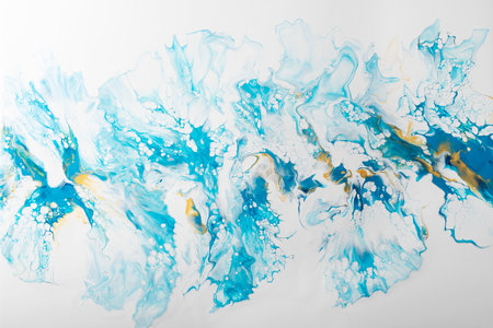 Fluid acrylic painting in blue and gold colors, selective focus image