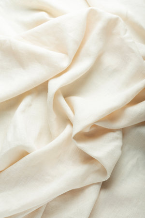 Sewing concept: stonewashed linen fabric in cream color