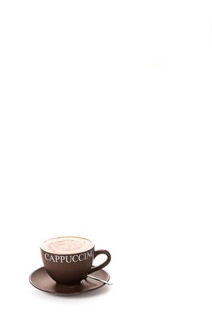 Cappuccino cup an saucer in the bottom cornerの写真素材