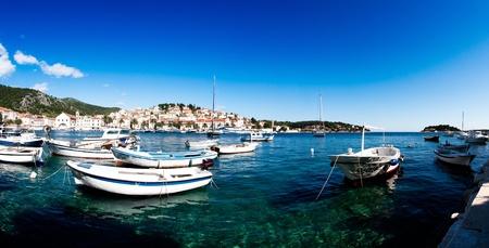 Panoramic view of the old town of Hvar in Croatia with boats in the foreground.の写真素材