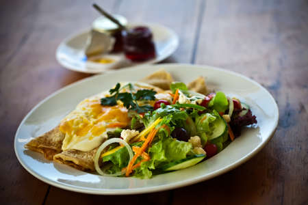Pancakes and eggs with jam の写真素材