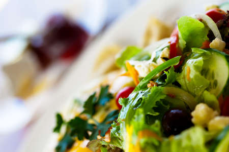 Cucumber salad with lettuce and olives の写真素材