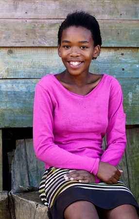 Colour of this young lady's shirt is just as bright that smile.の写真素材