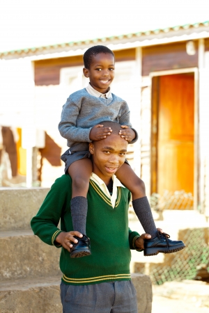Boy trust his big brother to keep him safe high up in the air.の写真素材