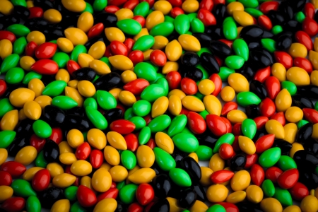 The different folded colors of diffentt beans in a potの写真素材