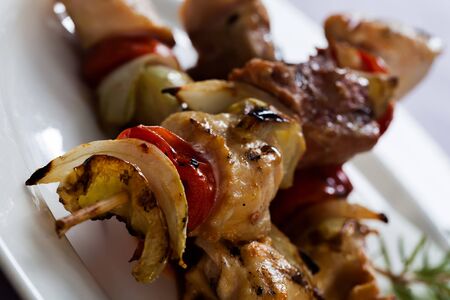 Bacon sticks with potato skins, tomato and apples の写真素材