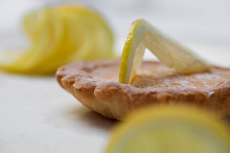 Lemin biscuit with a filling inside of the cookie and lemons on top の写真素材