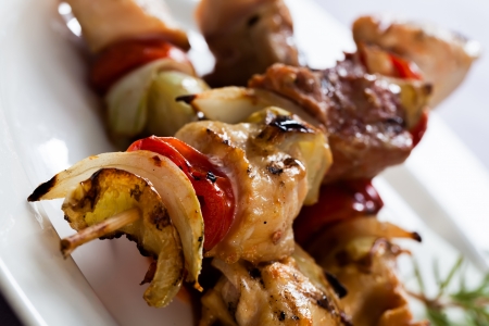 Bacon sticks with potato skins, tomato and apples.の写真素材