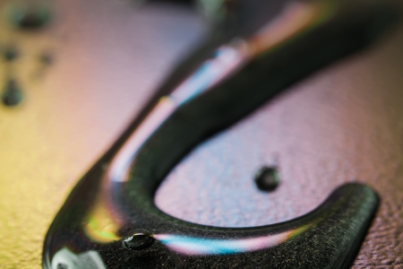 Green, black hook with a coloured gradient in the background.の写真素材