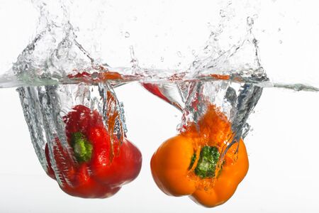 Two peppers in clear, fresh water の写真素材