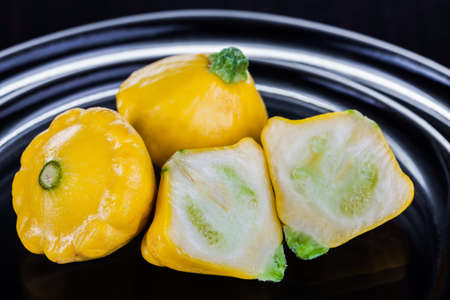 These three yellow vegetables is being photographed in studio の写真素材