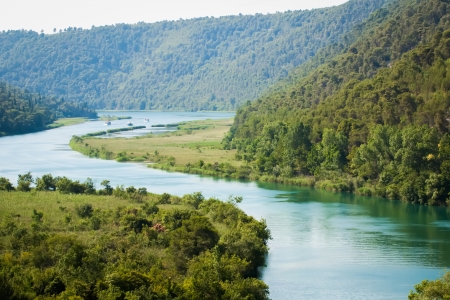 A long and wide river with three boats の写真素材