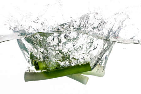There are three leeks thrown into clear water の写真素材