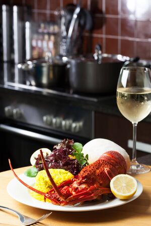 Crayfish on a table served with wine.の写真素材