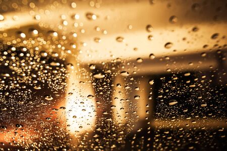 There are hundreds of rain drops on the window.の写真素材