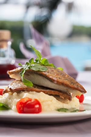 Biacuits with some fish and top it of with mash.の写真素材