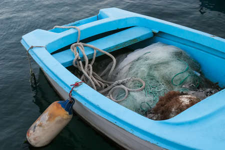 A very old fishing boat tied to shore at Hermanus.