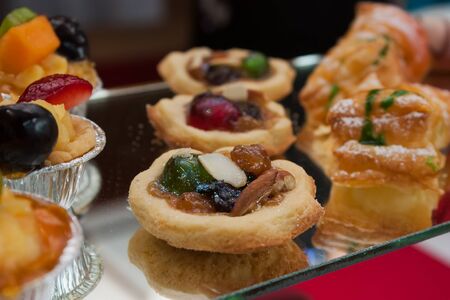 A nut and berry tart on the mirror platterの写真素材