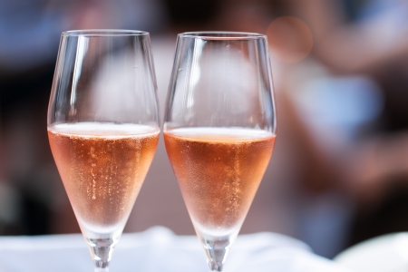 Two glasses of pink champagne for the couple.の写真素材