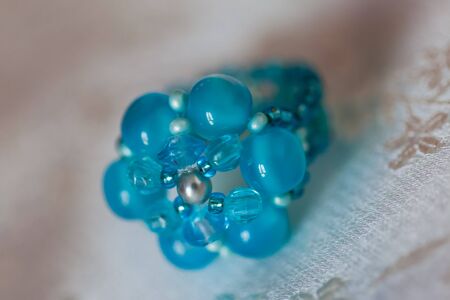 A small blue beading ring for a special girl.の写真素材