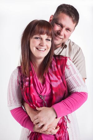 A young married couple being photographed in the studio.の写真素材