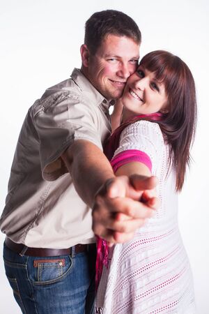 A young, playful married couple being photographed in the studio.の写真素材
