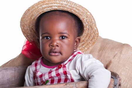A small African baby girl from the farm in the studio.の写真素材