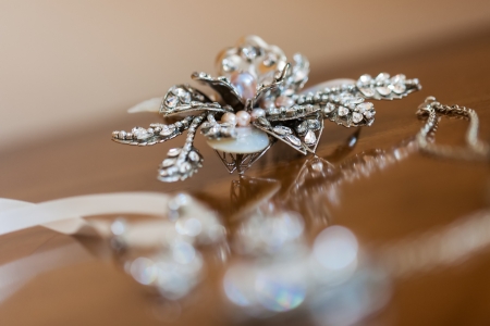 Some diamond accessorize being photographed on a table.の写真素材