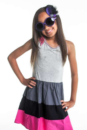 Stripe dress and big purple glass with a small head dress.の写真素材