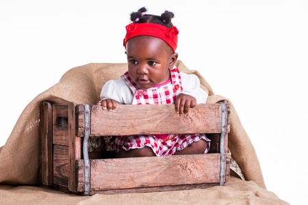 A little girl are safe in a box.の写真素材