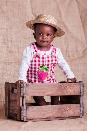 A small African baby girl from the farm in the studio.の写真素材