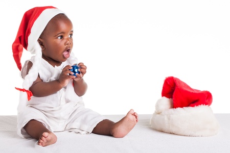 A tiny African baby girl are ready for her first Christmas to arrive.の写真素材