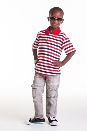 Little boy dressed in stripes and denim の写真素材