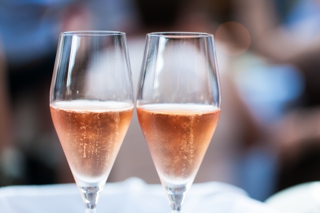 Two glasses filled with pink champagneの写真素材