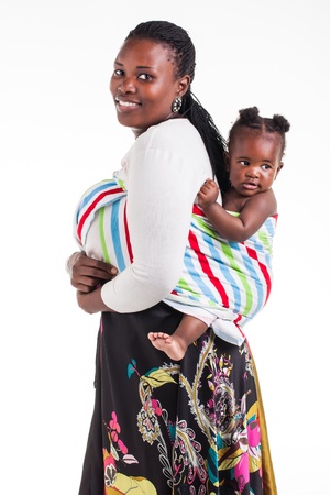 A young mother with 8 month old baby being photographed in the studio の写真素材