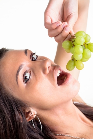 Grapes were chosen to go to the mouth の写真素材