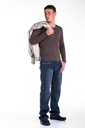 A young teenage boy being photographed in a studio の写真素材