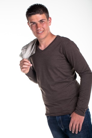 A young teenage boy being photographed in a studio の写真素材