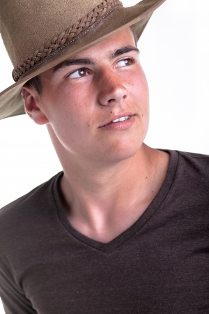 A young teenage boy being photographed in a studio の写真素材