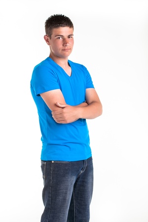 A young teenage boy being photographed in a studio の写真素材