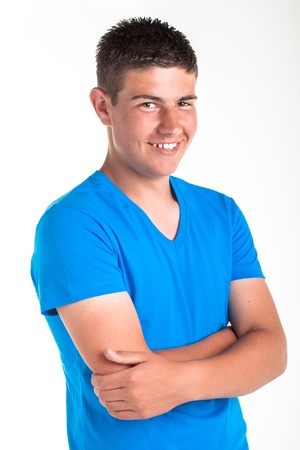 A young teenage boy being photographed in a studio の写真素材