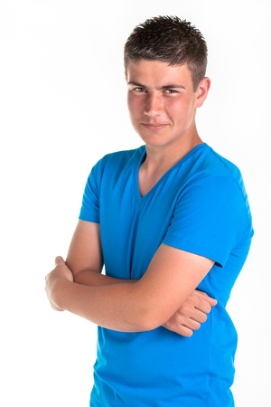 A young teenage boy being photographed in a studio の写真素材