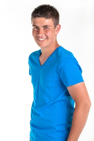 A young teenage boy being photographed in a studio の写真素材